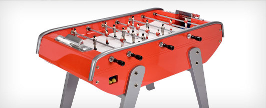 Silver and red foosball table